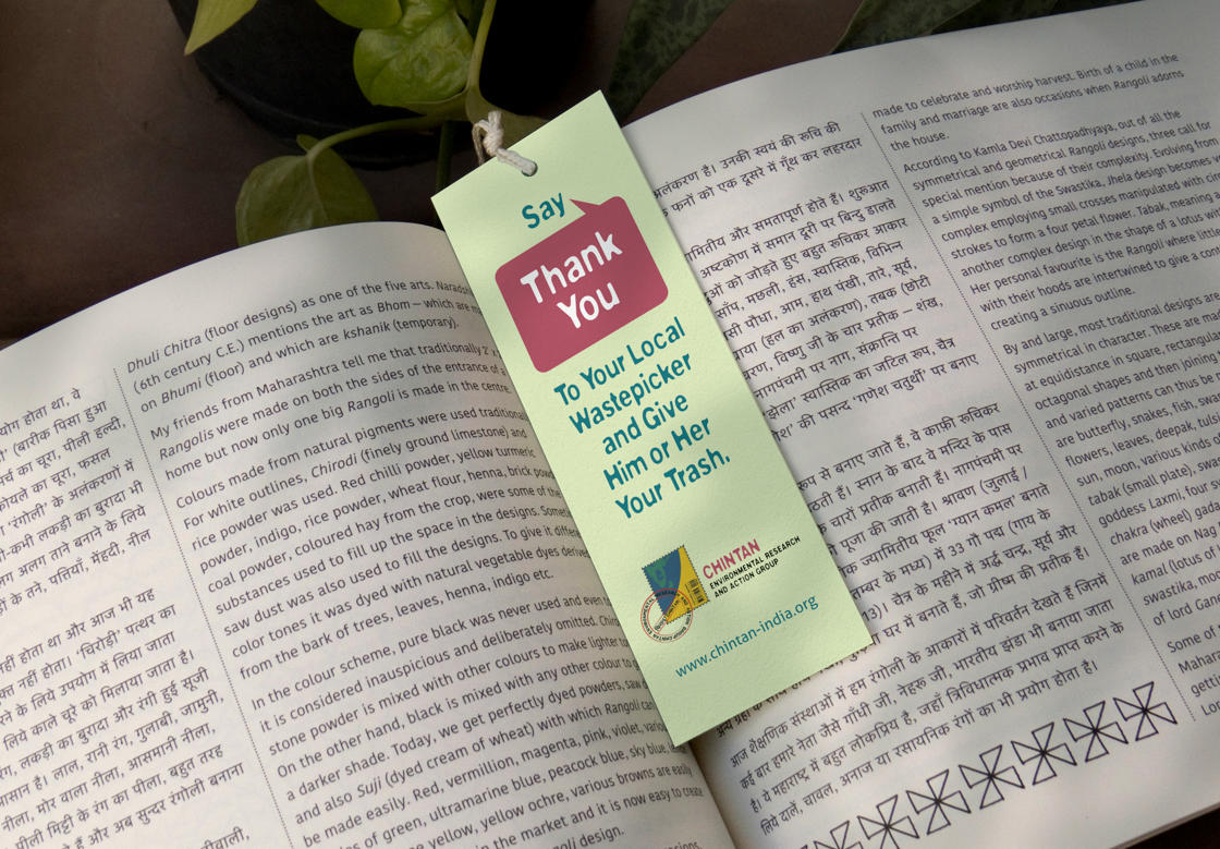 A printed bookmark placed within an open book