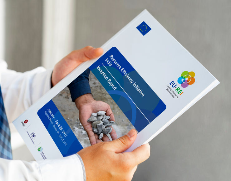 A person holding the report in hand