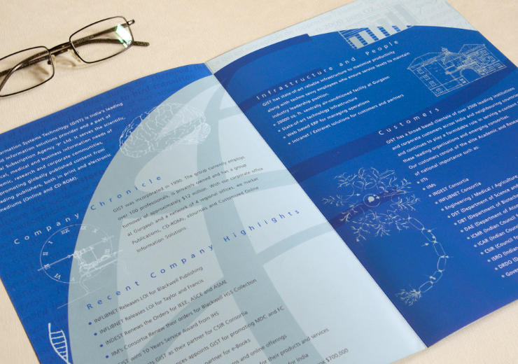 GIST corporate brochure, opened or spread on a work table