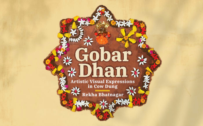 A star shape made up of cow dung and flowers, containing the book title