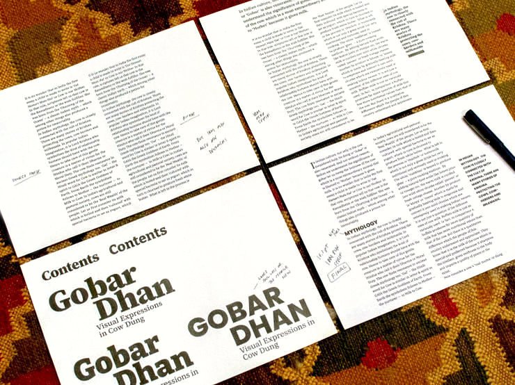 Four printouts with text and name of the book on them, in different fonts