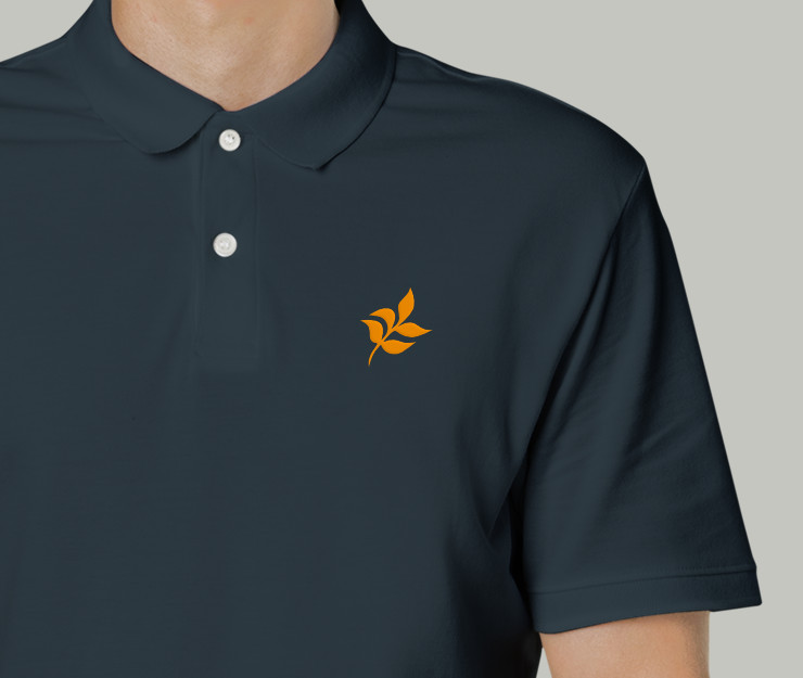 A small orange leaf printed on a dark t-shirt