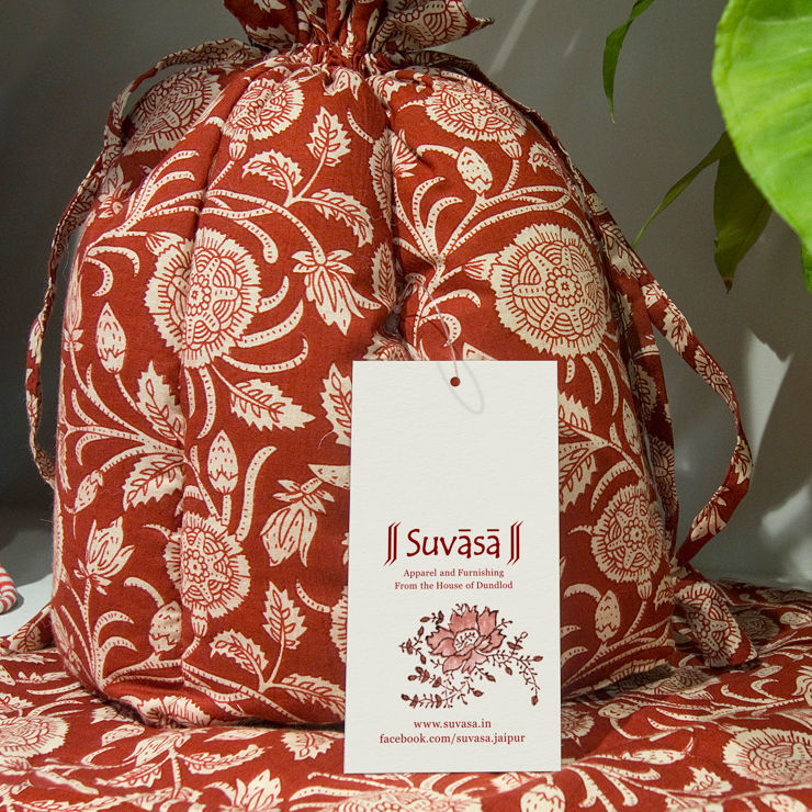 Main tag tied to a beautifully printed cloth bag with floral designs