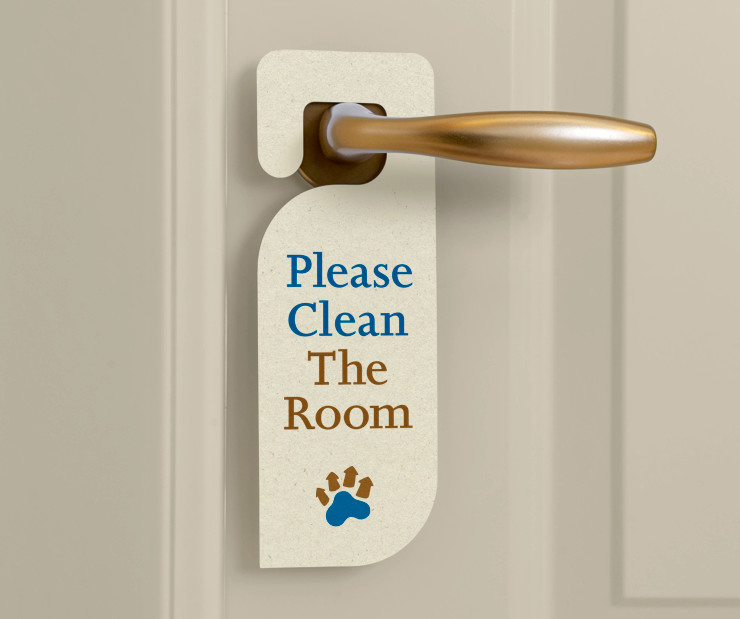 The logo on a 'Clean the Room' sign hanging from a door handle