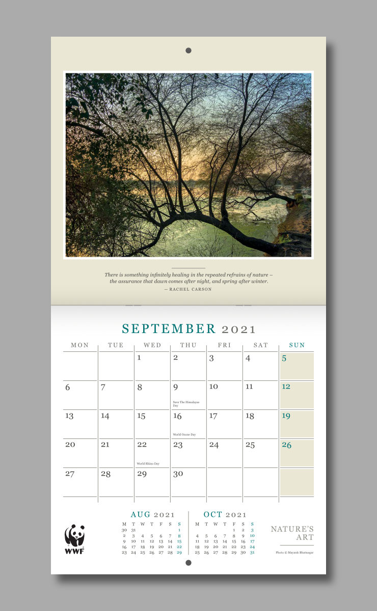 September spread of the open calendar featuring an intricate silhouette of a tree